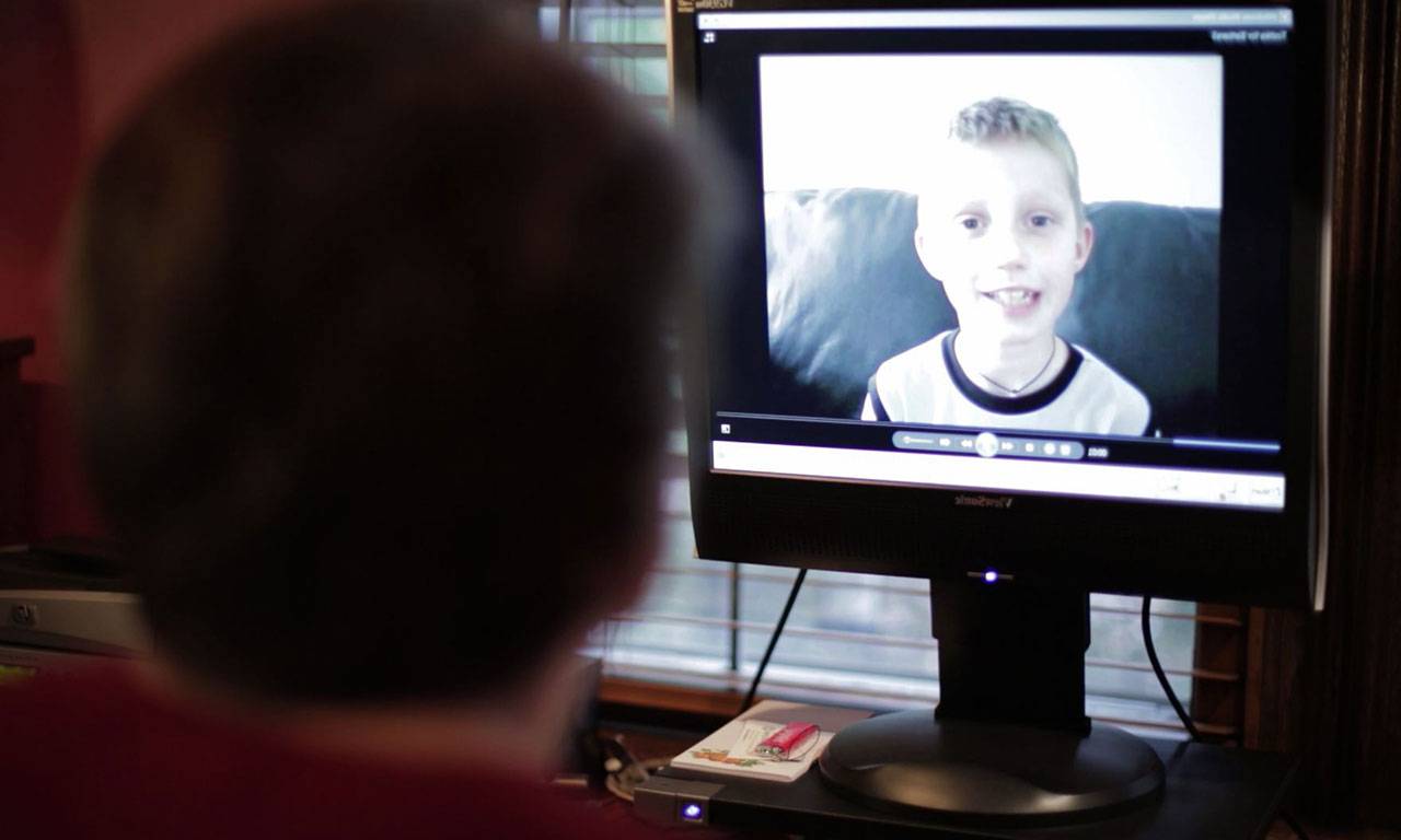 The image of a boy on a computer screen.
